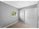 Bedroom with plush carpeting, a window, and a closet provides a cozy and serene retreat at 9319 Rochelle Dr, Indianapolis, IN 46235