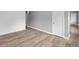 Bright, neutral living room showcasing new floors, gray walls and contrasting white trim and doors at 9319 Rochelle Dr, Indianapolis, IN 46235