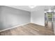 Neutral living room showcases new floors, gray walls, white trim, and abundant natural light at 9319 Rochelle Dr, Indianapolis, IN 46235