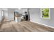 Open concept living area showcases updated kitchen with a window overlooking the lush backyard at 9319 Rochelle Dr, Indianapolis, IN 46235