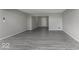 Large open basement featuring durable gray flooring and neutral colored walls, ready for customization at 9665 Gull Lake Dr, Indianapolis, IN 46239