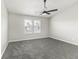 Bedroom features a ceiling fan and window overlooking the backyard at 9665 Gull Lake Dr, Indianapolis, IN 46239