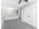 Upstairs bonus room with ceiling fan, and double doors at 9665 Gull Lake Dr, Indianapolis, IN 46239