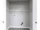 A spacious closet with a wire shelf and laundry hookups at 9665 Gull Lake Dr, Indianapolis, IN 46239