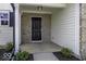 Inviting entrance featuring a brick facade, white siding, and a dark-colored front door at 9665 Gull Lake Dr, Indianapolis, IN 46239