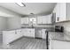 Modern kitchen features granite countertops, stainless steel appliances, and white cabinets at 9665 Gull Lake Dr, Indianapolis, IN 46239
