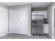Bright kitchen features stainless steel refrigerator, white cabinets, and light gray walls at 9665 Gull Lake Dr, Indianapolis, IN 46239