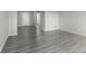 Open-concept living room features durable gray vinyl flooring and neutral colored walls, perfect for entertaining at 9665 Gull Lake Dr, Indianapolis, IN 46239