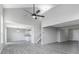 Bright and spacious living room features durable gray floors and high ceilings with lots of natural light at 9665 Gull Lake Dr, Indianapolis, IN 46239
