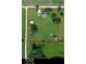 Expansive aerial view of property featuring a well-maintained lawn, outbuildings, and a charming home surrounded by mature trees at 9721 S 100 E, Pendleton, IN 46064