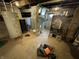 Unfinished basement with water heater and heating system, offering space for storage or utilities at 9721 S 100 E, Pendleton, IN 46064