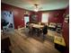 View of the dining room with hardwood floors, ceiling fan and traditional wood furnishings at 9721 S 100 E, Pendleton, IN 46064