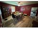 View of the dining room with hardwood floors, china cabinet and modern washing machine at 9721 S 100 E, Pendleton, IN 46064