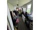 Enclosed porch featuring multiple windows, an exterior door, and ample space for storage at 9721 S 100 E, Pendleton, IN 46064