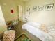 Bright bedroom with neutral walls, carpeted floor, and whimsical decorations at 1002 S Fleming St, Indianapolis, IN 46241