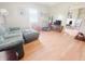 Bright living room featuring hardwood floors, a comfortable sofa, and plenty of natural light at 1002 S Fleming St, Indianapolis, IN 46241