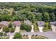 Aerial view of several homes in a neighborhood surrounded by lush trees at 10381 Beaver Ridge Dr, Fishers, IN 46037