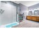 Bright bathroom features a glass shower, double vanity, and modern finishes at 10381 Beaver Ridge Dr, Fishers, IN 46037
