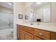 Well-lit bathroom boasts a spacious vanity, sink, and framed mirror with a shower-tub combination at 10381 Beaver Ridge Dr, Fishers, IN 46037