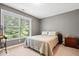 Cozy bedroom with large window providing natural light and outdoor views at 10381 Beaver Ridge Dr, Fishers, IN 46037