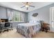 Comfortable bedroom with large window, light-grey walls, and soft carpet at 10381 Beaver Ridge Dr, Fishers, IN 46037