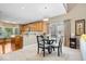 Cozy dining area adjacent to the kitchen with a stylish chandelier and large windows for natural light at 10381 Beaver Ridge Dr, Fishers, IN 46037