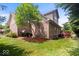 Brick home featuring a lush green lawn and mature landscaping, offering great curb appeal at 10381 Beaver Ridge Dr, Fishers, IN 46037