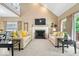 Inviting living room features a fireplace, neutral tones, and large windows providing natural light at 10381 Beaver Ridge Dr, Fishers, IN 46037
