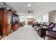 Large basement living room with leather furniture, and a tv at 10381 Beaver Ridge Dr, Fishers, IN 46037
