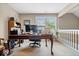 Bright office space featuring a large desk, and ample natural light at 10381 Beaver Ridge Dr, Fishers, IN 46037