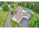 Aerial view of home featuring a pool, and meticulous landscaping enhancing this stunning property at 10594 Geist Rd, Fishers, IN 46037