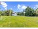 Backyard with sprawling lawn and detached two-car garage offers ample space and potential at 10594 Geist Rd, Fishers, IN 46037