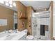 Well-lit bathroom with a glass shower, stylish vanity, and unique decor accents at 10594 Geist Rd, Fishers, IN 46037