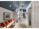 Bright bathroom featuring a blue ceiling, chandeliers, tile flooring, and a walk-in closet at 10594 Geist Rd, Fishers, IN 46037