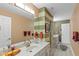 Bathroom featuring striped walls, double mirrors, white countertops and decorative accents at 10594 Geist Rd, Fishers, IN 46037