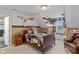 Attic bedroom featuring charming decor, including a quilt, sports memorabilia, and vintage accents at 10594 Geist Rd, Fishers, IN 46037