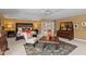 Spacious bedroom featuring a bed, seating, and a stylish rug and furniture at 10594 Geist Rd, Fishers, IN 46037
