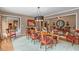 Elegant dining room with hardwood floors, chandelier, and charming decor, ideal for gatherings and special occasions at 10594 Geist Rd, Fishers, IN 46037