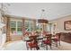 Chic dining area featuring a pool view, stylish decor, and abundant natural light, perfect for entertaining guests at 10594 Geist Rd, Fishers, IN 46037