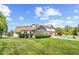 Stunning exterior of a home with an in-ground pool, a screened porch, and well-manicured landscaping at 10594 Geist Rd, Fishers, IN 46037