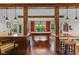 Game room with a full-size pool table, hardwood floors and a bar at 10594 Geist Rd, Fishers, IN 46037