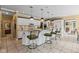 Bright kitchen with granite counters, modern appliances, a breakfast bar, and seamless access to other living spaces at 10594 Geist Rd, Fishers, IN 46037
