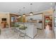 Open kitchen with a breakfast bar, granite countertops, pendant lighting, and seamless flow to the living areas at 10594 Geist Rd, Fishers, IN 46037