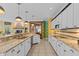 Spacious kitchen with white cabinets, granite countertops, tile backsplash, and stainless steel appliances at 10594 Geist Rd, Fishers, IN 46037