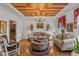 Charming living room featuring an ornate ceiling, hardwood floors, and two sofas at 10594 Geist Rd, Fishers, IN 46037
