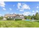 Exterior of home with pool, lounge seating, and well-manicured backyard perfect for entertaining at 10594 Geist Rd, Fishers, IN 46037