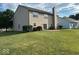 Spacious backyard featuring a large lawn, mature trees, and a patio perfect for outdoor entertaining at 11154 Schoolhouse Rd, Fishers, IN 46037