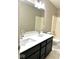 Bathroom featuring a double sink vanity with modern fixtures, large mirror, and walk-in shower at 11154 Schoolhouse Rd, Fishers, IN 46037
