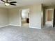 Bedroom featuring carpet floors, neutral walls, with open doorways to a bathroom and another room at 11154 Schoolhouse Rd, Fishers, IN 46037