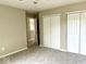 Spacious bedroom featuring neutral paint, soft carpet, and a double door closet at 11154 Schoolhouse Rd, Fishers, IN 46037